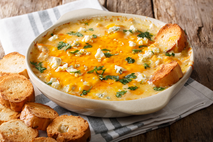 Weight Watchers Buffalo Chicken Dip Recipe baked in a dish with toasted bread slices