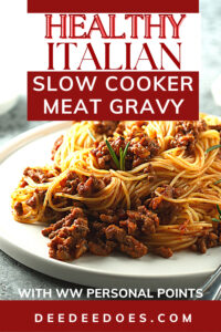 Healthy Slow Cooker Italian Meat Sauce over pasta on white plate