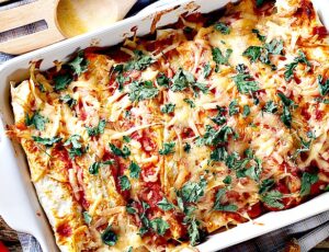 Paula Deen's Recipe for Enchiladas with Red Chili Gravy - Made Healthy and baked in white pan