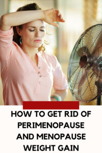 menopausal woman standing in front of a fan and sweating
