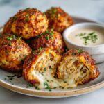Crispy turkey cottage cheese protein bites with melted cheese inside served with creamy dipping sauce