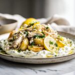 Rotisserie chicken whipped feta lemon plate with roasted baby potatoes, shredded rotisserie chicken, creamy whipped feta, lemon slices, olive oil and fresh parsley.